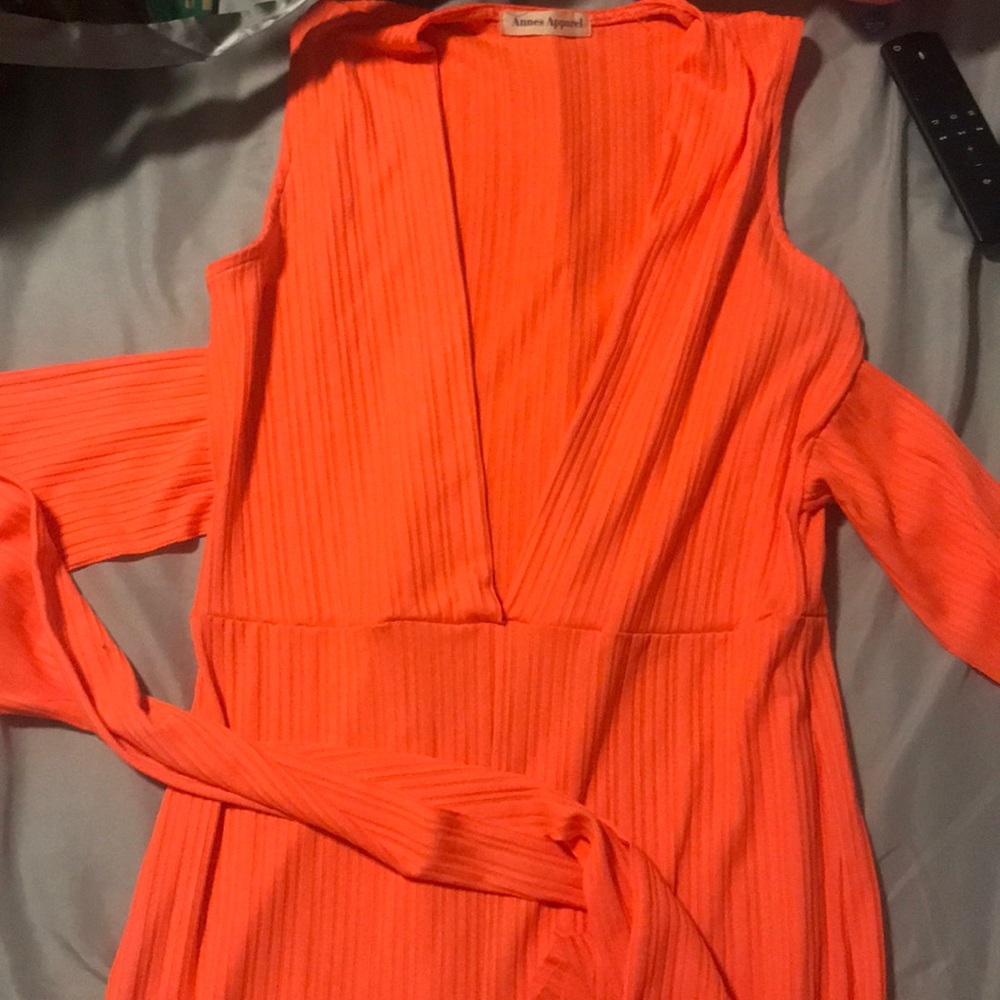 Neon pink one piece with straps to wrap around